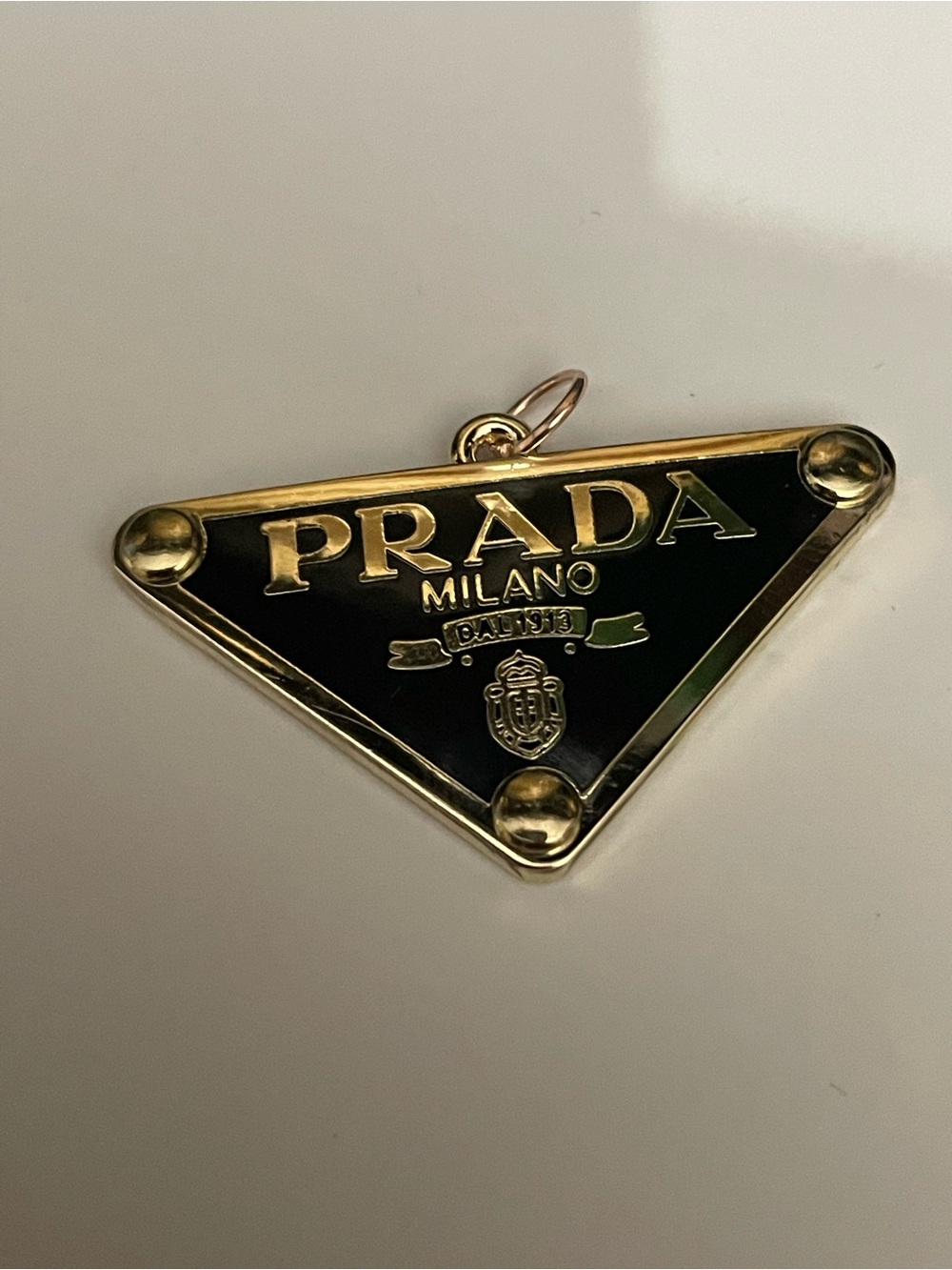 Authentic PRADA Milano Triangle Logo Charm in Black and Gold free chain